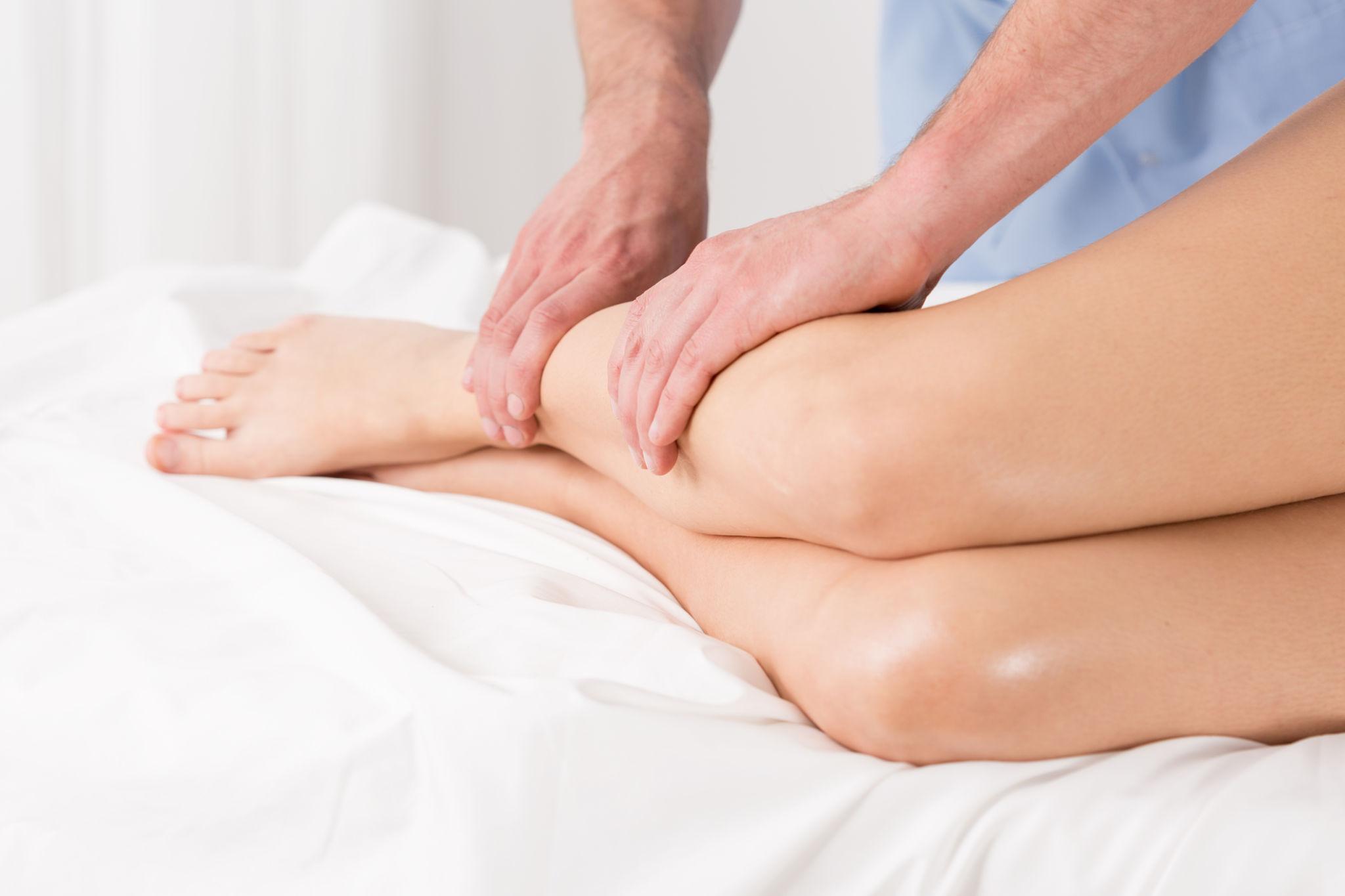 Therapist performing gentle manual lymphatic drainage massage